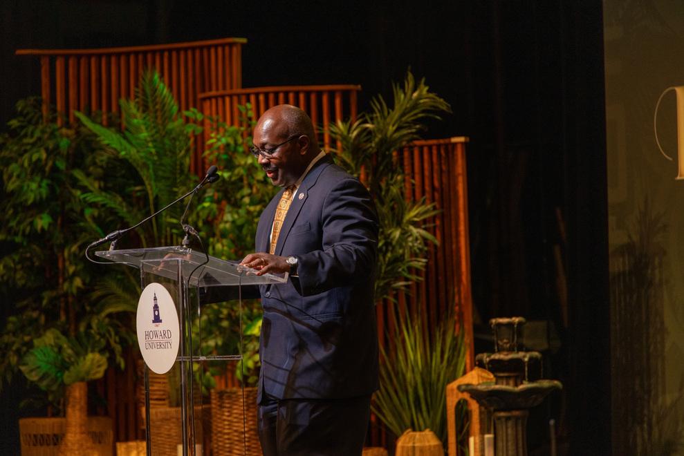 Provost Anthony K. Wutoh, wearing a dark suit, at the Asantehene visit at Howard University's Cramton Auditorium