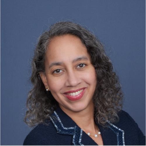 Talitha Washington smiling wearing a blue top