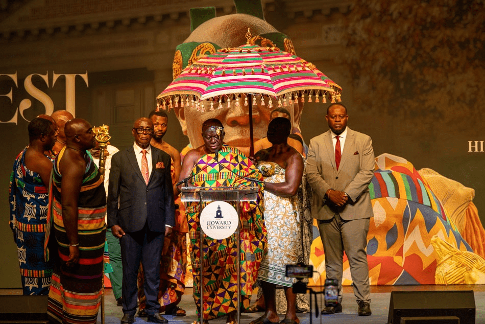 The Asantehene visits Howard University's Cramton Auditorium dressed in colorful traditional Ghanian attire