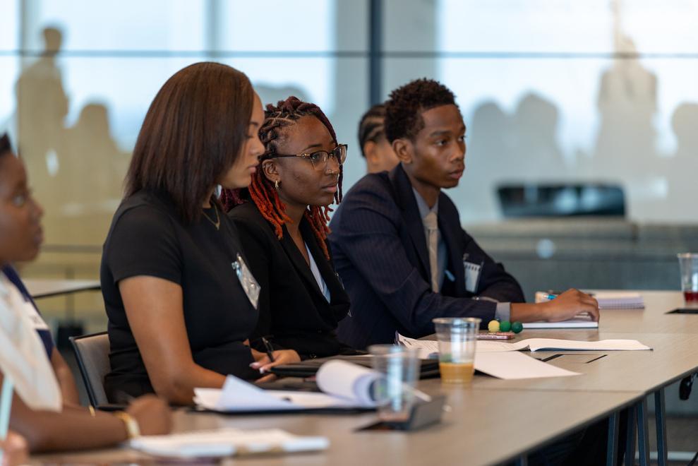 Howard University students at Marriott International during a visit seated side by side