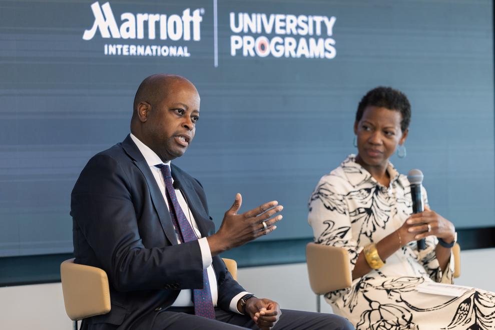 Dr. Wayne A. I. Frederick and Marisa Milton seated side by side at Marriott International