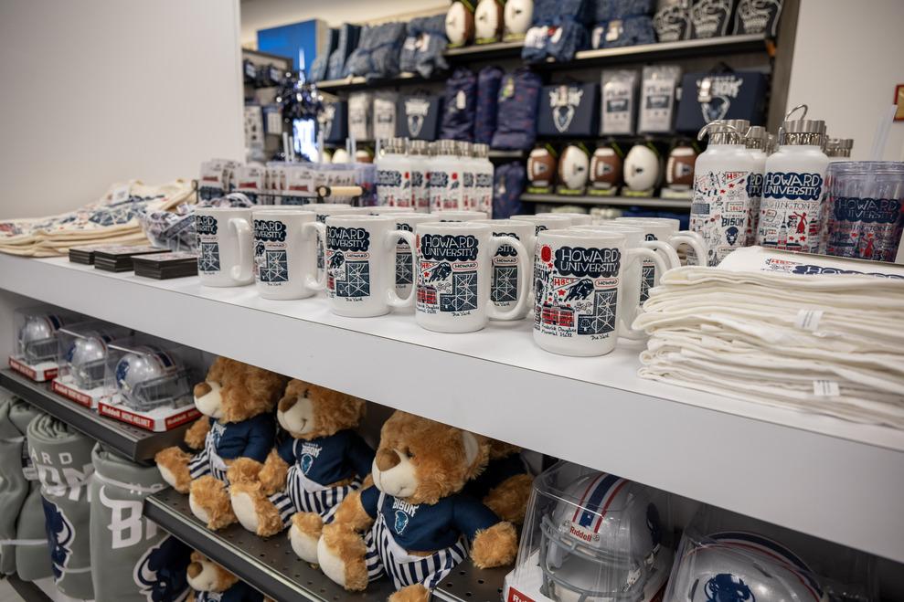 Merchandise at the Bison Exchange Campus Store including coffee mugs
