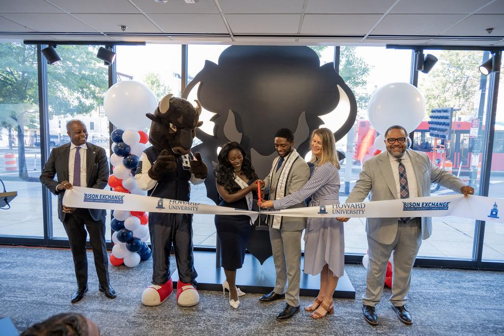 VIPs at the grand reopening of the Bison Exchange Campus Store cutting the ribbon