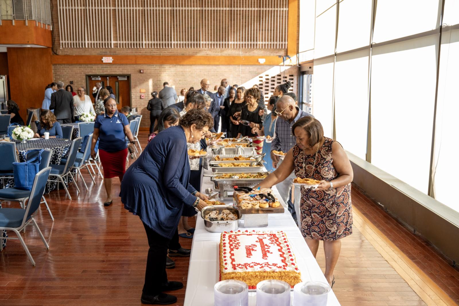 Howard University retirees at Retirement Celebration breakfast putting food on their plates
