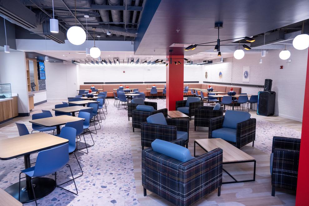 Blue chairs and wood tables at the new PunchOut