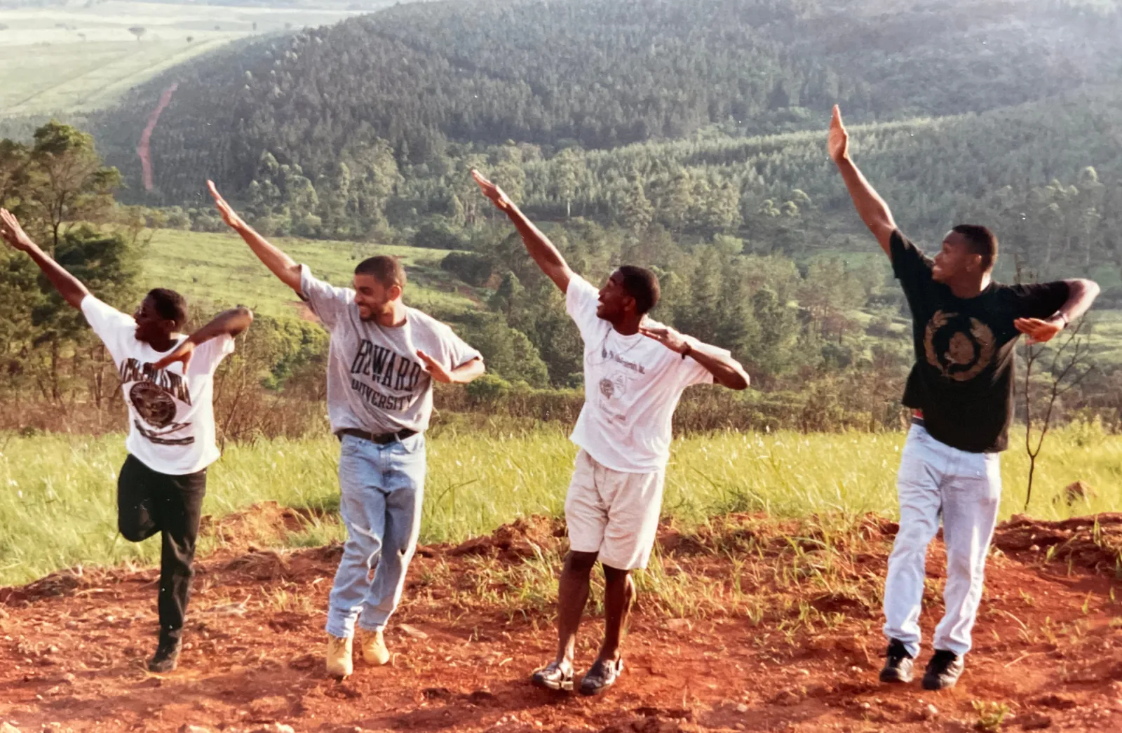 C. Brian Williams in South Africa surrounded by fraternity brothers at the founding at Step Afrika! in 1994
